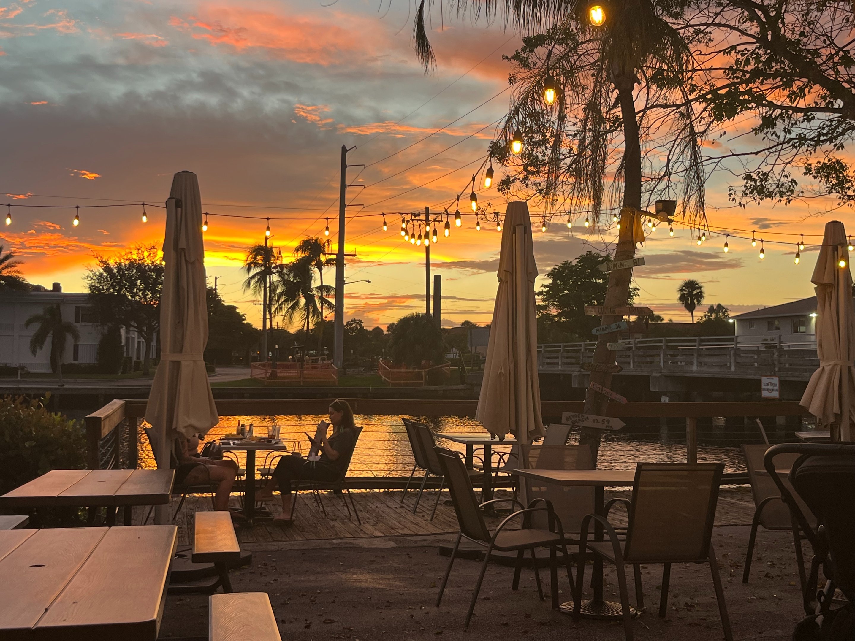 Sunset over the waterfront patio at Brewfish